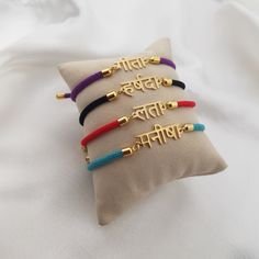 𝐻𝑜𝓌 𝒯𝑜 𝒪𝓇𝒹𝑒𝓇 - Choose cord color. - Leave the name/word in the personalization box in Marathi letters only. - You can use a virtual keyboard:  https://www.lexilogos.com/keyboard/devanagari.htm - Up to 11 characters. 𝐼𝓉𝑒𝓂 𝒟𝑒𝓈𝒸𝓇𝒾𝓅𝓉𝒾𝑜𝓃 Marathi Name Bracelet. Name dimensions: height: 7-9mm, width 15-35mm. Bracelet length: adjustable up to 7". 𝒪𝓇𝒹𝑒𝓇 𝐻𝒶𝓃𝒹𝓁𝒾𝓃𝑔 𝒯𝒾𝓂𝑒 Order processing time for our items is 3-5 business days, please note it does not include the del Traditional Adjustable Personalized Bracelets, Festive Adjustable Personalized Bracelets, Multicolor Spiritual Bracelets For Puja, Spiritual Multicolor Bracelets For Puja, Spiritual Friendship Bracelets As Festival Gifts, Traditional Gold Friendship Bracelets For Festivals, Traditional Personalized Bracelet As Gift, Marathi Letters, Nameplate Bracelet