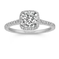 a cushion cut diamond ring with pave set shoulders