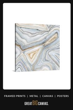 an abstract painting with white and blue colors on it's black frame, in the middle