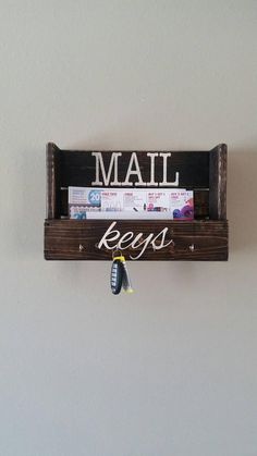 a mailbox hanging on the wall with keys