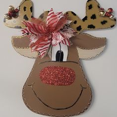 a cardboard reindeer head hanging on the wall