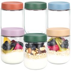 three glass jars filled with different types of food