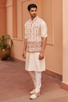 Ivory sleeveless bundi with blossom vine stripe print all over. Paired with a three fourth sleeves solid kurta and straight pant. - Aza Fashions White Sleeveless Nehru Jacket With Resham Embroidery, Sleeveless White Kurta For Diwali, White Embroidered Sleeveless Nehru Jacket, White Sleeveless Nehru Jacket For Festive Occasions, Sleeveless White Nehru Jacket For Festive Occasions, Festive White Sleeveless Nehru Jacket, Festive White Sets With Woven Motifs, Kurta Set Men, Kurta Set For Men