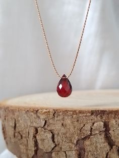 Dainty Red Garnet Teardrop Necklace Beautiful Rich Red natural Garnet faceted teardrop gemstones, approx 7-9mm 100% Silk Cord, Adjustable to 26" Sterling Silver Toggle Bead Beautiful gemstone luxury necklace, delicate piece Handmade in my home studio in Northern Ireland Item will be sent recorded delivery Luxury Red Birthstone Necklace, Red Gemstone Drop Necklace For Gift, Red Teardrop Gemstone Drop Necklace, Red Teardrop Gemstone Necklace, Faceted Teardrop Red Jewelry, Red Gemstone Pear-shaped Necklace, Red Briolette Necklaces For Jewelry Making, Red Briolette Beads For Jewelry Making, Red Pear-shaped Gemstone Necklace