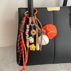 a black purse with various items hanging from it