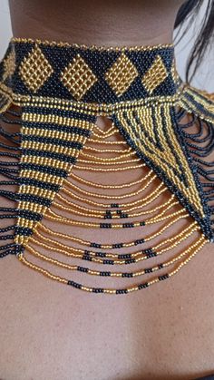 African wedding necklace, Zulu necklace, Beaded shawl necklace, African jewelry, Masai necklace, Bridesmaid necklace, Wedding gift This stunning necklace is superbly crafted with fine beads. The necklace can be worn with any outfit at different occasions and it will absolutely makes you stand out. 100% handmade using fine beads. Closure: ball joint Color: gold and black. 3-5 days delivery via DHL Express The shipping fee is for the first item only and additional necklaces or items ship for free. Bohemian Beaded Necklaces With Round Beads For Wedding, Bohemian Beaded Necklace With Round Beads For Wedding, Bohemian Beaded Necklaces For Wedding, Bohemian Tiny Beads For Wedding, Bohemian Tiny Beads Necklaces For Wedding, Bohemian Necklaces With Round Beads For Wedding, Adjustable Beaded Chain Necklaces For Wedding, Bohemian Beaded Choker Necklace For Wedding, Bohemian Beaded Bib Necklace For Wedding