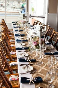 the table is set with blue and white place settings