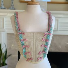 Marie Antoinette Pink Bow Corset - Etsy Feminine Lace Corset With Corset Back, Pink Lace Trim Underbust Corset, Pink Lace Underbust Corset, Pink Underbust Corset With Lace Trim, Pink Feminine Underbust Corset, Pink Underbust Feminine Corset, Feminine Pink Underbust Corset, Pink Lace Corset With Boned Bodice, Sleeveless Beige Corset With Corset Back