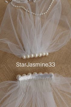 Veil Ivory Tulle Birdcage Veil Vintage Style Petite Veil Mini Illusion Tulle Veil Pearls Birdcage Veil Vintage Style Veil Mini BlusherElegant and subtle bridal illusion mini veil. Measures 10 inches ( 25 cm);12 inches (30cm);14 inches(36cm) #wedding #veil #tulle Elegant Tulle Bridal Accessories For Bridal Shower, Elegant Tulle Veil For Bridal Shower, Elegant Cream Tulle Fabric For Wedding, Elegant Tulle Bridal Accessories For Bride, Elegant Bridal Accessories In Tulle, Elegant Cream Tulle Veil, White Tulle Veil For Bridal Shower, White Tulle Bridal Accessories For Bridal Shower, Cream Tulle Wedding Veil