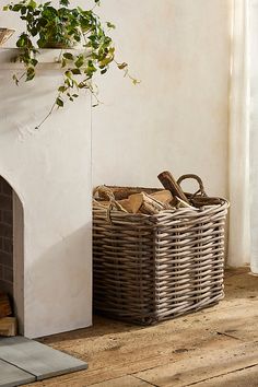 a basket sitting next to a fire place