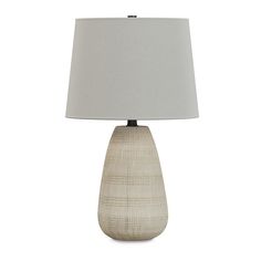 a table lamp with a white shade on the base and a light gray fabric shade on the top