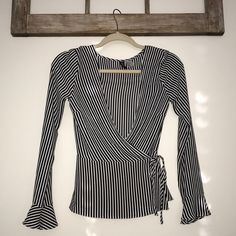 Black And White Striped Shirt, Ties On The Side. Can Make Into Crop If You Tuck The Bottom In!! Never Worn With Out Tags! Striped Fitted Top For Night Out, Fitted Striped Top For Night Out, H&m Striped Tops, Trendy H&m Tops For Work, H&m Casual Blouse For Night Out, H&m V-neck Top For Night Out, Striped Long Sleeve Tops From H&m, H&m V-neck Tops For Day Out, Spring Fitted Shirt By H&m