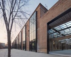 a brick building with lots of glass doors