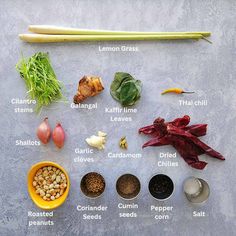 an assortment of vegetables and spices on a table