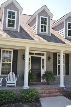 an instagram photo of a house with two white chairs on the front porch