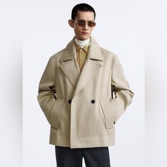 Zara Men’s Cropped Trench Coat. Never Worn, New With Tags. Beige Double-breasted Sport Coat For Fall, Business Beige Pea Coat With Pockets, Beige Casual Pea Coat For Business, Beige Pea Coat With Pockets For Business, Tailored Outerwear With Double Button Closure, Oversized Classic Gabardine Outerwear, Beige Double-breasted Outerwear With Welt Pockets, Beige Double Button Sport Coat For Fall, Oversized Beige Modern Outerwear