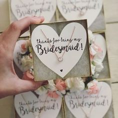 a person holding up a card that says, thank for being my bridesmaid