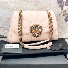 Beautiful Authentic Dolce & Gabbana Nappa Quilted Large Devotion Bag In Pale Pink. This Petite Bag Is Crafted Of Luxurious Calfskin Leather In Pink. The Bag Features An Aged Gold Chain Link And Pink Leather Shoulder Strap. This Bag Features A Gold Heart Decorated With Faux Pearls. The Gold Zipper Opens To A Leather Interior With A Card Slot. Very Good Condition With Minor Wear And Scuffs Throughout. Includes Tags And Dust Bag. No Box. Measures Approx 11.5”X8”X3.5”. Retails $2495. Luxury Pink Shoulder Bag With Removable Pouch, High-end Pink Shoulder Bag For Evening, Luxury Pink Bags As Gifts, Luxury Pink Bags For Gifts, Luxury Pink Shoulder Bag For Evening, Designer Pink Shoulder Bag For Formal Occasions, Designer Pink Clutch Shoulder Bag, Luxury Pink Clutch Bag, Designer Pink Clutch Bag