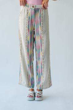 Introducing the Feia Embroidered Pant, perfect for adding some quirky style to your wardrobe. With colorful embroidery and a cream base, these pants are sure to make a statement. Step out in style while staying comfortable and unique. Details self: 61% acrylic + 22% polyester + 17% viscose lining: 100% cotton Fabric Care Guide Here Sizing & Fit Measurements are approximate and taken while laying flat across the front. Not doubled. small: waist = 15"; length = 42" ; inseam= 30" medium: waist = 15 White Bohemian Style Relaxed Fit Harem Pants, Multicolor High-waisted Cotton Pants, White Floral Embroidered Wide-leg Bottoms, Cream Floral Embroidery Bottoms For Summer, Beige Floral Embroidered Pants For Spring, White Wide-leg Pants With Floral Embroidery, Summer Cream Bottoms With Floral Embroidery, Beige Cotton Pants With Floral Embroidery, White Casual Pants With Floral Embroidery