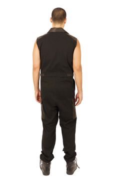 Festival streetwear takes a new shape with the Black Market, mens black jumpsuit. Our boiler suit for men was made for seamless transitions from Friday night drinks to warehouse raves. FEATURES: Made with medium weight, dead stock canvas thats super soft to the touch Accents in goatskin leather Asymmetrical zipper front unzips to reveal leather lapels 6 pockets: 2 zip pockets at the chest, 2 at the hips and 2 cargo pockets above the knee Adjustable waist straps with snaps Sleeveless Flight suit Fitted Streetwear Jumpsuits And Rompers, Fitted Streetwear Jumpsuits And Rompers Overall, Fitted Streetwear Jumpsuit Overall, Black Overall Jumpsuit For Streetwear, Black Overall Jumpsuits And Rompers For Streetwear, Fitted Overall Jumpsuits For Streetwear, Black Fitted Utility Overalls, Fitted Black Utility Overalls, Fitted Utility Overalls