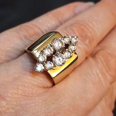 Gold plated steel ring size 6.  Metal stamp: TK316 Statement ring. High quality. Lots of sparkle. The CZs at the front of the ring are 21.5x9mm in total. The band is 5.5mm wide at the back. See our other rings here https://www.etsy.com/shop/BlueMoonTrader?search_query=ring and check back as we're going through our whole stash and listing new items often. These fashion rings make great gifts for your trendy friend, mother, father, sister, brother, aunt, uncle, niece or nephew. See all of our size Vs Clarity Open Cluster Ring For Anniversary, Anniversary Cluster Ring With Vs Clarity And Open Shape, Vs Clarity Wide Band Ring For Anniversary, Anniversary Wide Band Ring With Brilliant Cut, Anniversary Wide Band Diamond Ring With Vs Clarity, Anniversary Wide Band Open Ring With Brilliant Cut, Anniversary Brilliant Cut Open Wide Band Ring, Anniversary Diamond Wide Band Ring With Vs Clarity, Modernist Multi-stone Ring