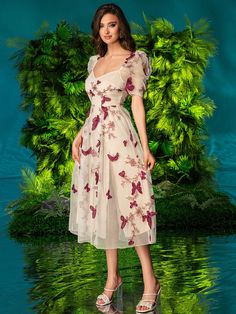 Introducing the Fluttering Beauty dress, designed for the elegant and sophisticated woman. This dress features double bubble sleeves and a 3D butterfly decoration, adding a touch of whimsy to its classic design. Perfect for any occasion, this dress exudes beauty and confidence. Color : Apricot Style : Casual Details : Ruffle, Zipper Pattern Type : Floral, Butterfly, Animal, All Over Print Type : A Line Sleeve Length : Short Sleeve Neckline : Sweetheart Sleeve Type : Puff Sleeve Waist Line : High Summer Party Midi Dress With Butterfly Sleeves, Summer Midi Dress With Butterfly Sleeves For Party, Spring Party Midi Dress With Butterfly Sleeves, Spring Party Dress With Butterfly Sleeves, Spring Evening Midi Dress With Butterfly Sleeves, Butterfly Sleeve Midi Dress With Ruffles For Party, Party Midi Dress With Ruffles And Butterfly Sleeves, Fitted Dress With Butterfly Sleeves For Parties, Summer Party Dress With Butterfly Embroidery