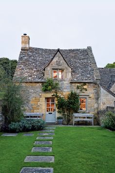 a stone house with the words tour a picture perfect country cottage