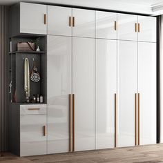 a large white closet with gold handles and drawers