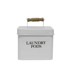 a white box with a wooden handle and the words laundry pods on it's lid