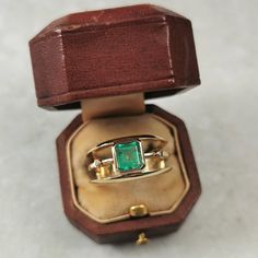 Estate 18k Emerald & Diamond Ring - marked 18k on inside back of band  - constructed of solid 18k yellow gold with genuine emerald and diamonds - an approx. 6.07 mm x 5.07 mm emerald cut emerald is bezel set at the centre of ring    - emerald weighs approx. 0.96ct    - stone has good clarity for an emerald, with 2 phase inclusions and fingerprints visible under high magnification    - Zambian emerald; high iron content = does not fluoresce     - vivid slightly bluish green  - ring consists of 3 Heirloom Tsavorite Emerald Ring In Gold, Classic Gold Ring With Tsavorite, Classic Yellow Gold Tsavorite Emerald Ring, Classic Yellow Gold Tsavorite Ring, Gia Certified Yellow Gold Emerald Ring For Formal Occasions, Formal Gia Certified Yellow Gold Emerald Ring, 14k Gold Gia Certified Emerald Ring For May Birthstone, Gia Certified 14k Gold Emerald Ring For May Birthstone, Heirloom Emerald Ring With Vvs Clarity