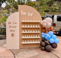 there is a display with balloons in the shape of bottles and chess pieces on it