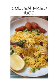 a white plate topped with rice and veggies next to a slice of lemon