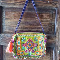 This Neon, Multicolored And Textured Bag/Purse Is The Cutest Addition To Your Wardrobe. Features An Adjustable Strap For Your Comfort. Inside Is Medium Sized Deep So Will Fit A Wallet, Keys, Notepad, And Several Other Items. Has One Pocket On The Inside With A Zipper. Also Features A Cute Tassle. Purple Shoulder Bag For Spring Vacation, Spring Vacation Purple Shoulder Bag, Casual Purple Bags For Festival, Purple Bohemian Bags For Spring, Purple Bohemian Shoulder Bag For Summer, Multicolor Bohemian Handheld Bag, Colorful Bohemian Square Shoulder Bag, Multicolor Bohemian Square Shoulder Bag, Bohemian Handmade Multicolor Coin Purse