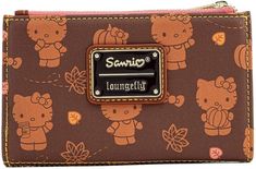 a brown hello kitty wallet with the name sanrio on it