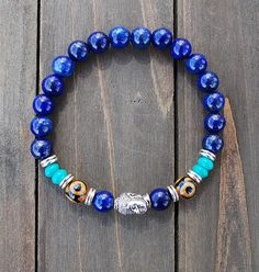 Bracelet Mala- Lapis Lazuli Buddha Blue Spiritual Stretch Bracelet For Meditation, Blue Spiritual Stretch Bracelet With Round Beads, Blue Polished Beads Spiritual Stretch Bracelet, Spiritual Blue Stretch Bracelet With Polished Beads, Adjustable Lapis Lazuli Beaded Bracelets For Meditation, Adjustable Lapis Lazuli Stretch Bracelet With Round Beads, Symbolic Adjustable Stretch Bracelet With Round Beads, Bohemian Beaded Bracelets With Silver Beads For Meditation, Spiritual Silver Beaded Bracelets