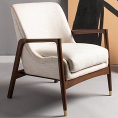 Immerse yourself in the beauty of Scandinavian design with this Flannery Mid-Century Accent Chair. Generously upholstered in a decadent cream linen blend, Flannerys sleek angles and subtle curves are crafted with sustainable teak wood in a rich, dark mahogany finish. Designers love its brass-capped front legs. FeaturesFull Dimensions: 27.2" x 29.5" x 32.3"Fill Material: Foam/PaddingCrafted of Wood/Fabric/MetalWeight Capacity: 275Seat Dimensions: 19"X21.5"X18"Made In: IndonesiaDue to lighting and monitor differences, actual colors and finishes may vary slightly from what appears online. Upholstery Care: To prevent overall soiling, frequent vacuuming or light brushing is recommended. Cushions and pillows should be turned on a weekly basis. Down filled cushions should be brushed rather than v Mid Century Accent Chair, Accent Chair Set, Dark Mahogany, Wood Care, Nebraska Furniture Mart, Accent Chair, Teak Wood, Living Room Chairs, Scandinavian Design