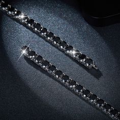 Add a touch of sparkle to your everyday style with this exquisite Black Moissanite Diamond Tennis Chain Bracelet. Its unique design and dazzling shine will make you stand out and catch everyone's eye. Made with high-quality 925 sterling silver and white gold plating, this bracelet will be a timeless addition to your collection. Special Note 925 sterling silver base material and moissanite stones set tennis chain need to be made to order.Made to order production time: 1-2 days All of our moissanite diamonds are able to pass the diamond tester. GRA report is provided on all moissanite orders. All custom orders are not able to be cancelled and non-refundable. Details Material 925 Sterling Silver Length 7"/ 7.5"/ 8"/ 8.5" Color Grade D Clarity Grade VVS1 Cut Grade Excellent Package content A c Diamond Cuff Bracelet, Silver Tennis Bracelet, Tennis Chain, 925 Silver Bracelet, Bracelet Argent, Mens Jewelry Bracelet, Elegant Accessories, Wedding Bracelet, Moissanite Diamonds