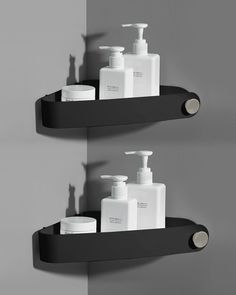 two black shelves with soap and lotion on them