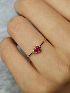 Natural Ruby Ring handcrafted in 14k gold, tear drop ring, 14k gold ring. This is a beautiful ruby ring with tiny heart cut out in the back - 100% handcrafted which can become a wonderful treasure to cherish for years to come. Ruby is July birthstone. CENTRAL STONE: * natural, Earth mined gemstone- ruby * teardrop placed horizontally APPROXIMATE MEASUREMENTS OF THE RING: *band: approximately 1 mm *material: 14k gold (yellow/rose/white) *size- please pick from the drop down menu. If you need othe 14k Gold Ruby Ring Gift, Fine Jewelry Ruby Ring As Gift, Engraved Ruby Ring For Gift, Yellow Gold Ruby Diamond Ring Gift, Dainty Ruby Ring For Formal Occasions, Rose Gold Ruby Ring With Bezel Setting For Gift, Rose Gold Ruby Ring With Bezel Setting As Gift, Rose Gold Ruby Ring For Promise, Rose Gold Ruby Ring As Gift