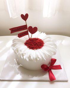 a cake decorated with red and white icing