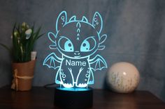 a personalized night light with an image of a cute dragon on it's face