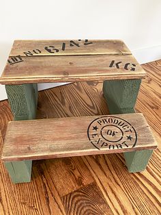 two wooden step stools sitting on top of a hard wood floor