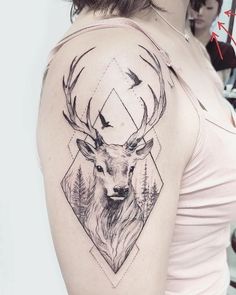 a woman with a deer tattoo on her shoulder