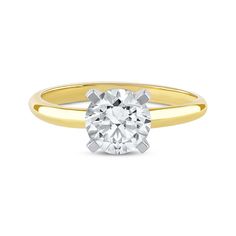 a yellow and white gold engagement ring with a round brilliant cut diamond in the center