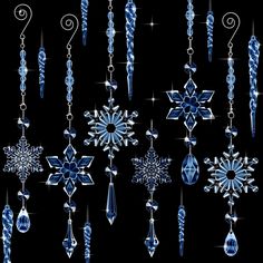 snowflakes and ornaments are hanging from chains on a black background with sparkles