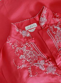 "Stunning Vintage 1950s Chinese silk blouse Hand embroidered floral motif frog closure buttons down front Great vintage condition M e a s u r e m e n t s: Size: vintage sz. M fits like a S M Bust: 18 1/2\" Waist: 18\" Total length: 24\" Sleeves: 21\" Fabric: 100% silk Label: hand Embroidery Made in China +All Measurements are taking while garment is lying flat+ i n s t a g r a m: cali_vintage_usa --------------------------------------------------------------------------------" Pink Spring Wedding Blouse, Embroidered Silk Tops For Summer, Traditional Tops For Spring Wedding, Festive Vintage Long Sleeve Blouse, Silk Summer Tops With Floral Embroidery, Spring Silk Blouse With Floral Embroidery, Vintage Pink Blouse For Spring, Traditional Tops With Buttons For Spring, Vintage Silk Tops For Summer