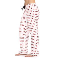 Mini red hearts make the cutest pajama pants. Perfect for lounging around home, with boyfriend, or at a girly sleepover. Their 100% polyester jersey knit fabric, along with the relaxed fit, makes for the ultimate comfort choice. Meanwhile, the back elastic with the drawstring tie creates the perfect fit while the all-over-print polka dot hearts brings the vibe.  .: 100% polyester .: White seam thread .: Light fabric (6 oz/yd² (203 g/m .: Relaxed comfort fit .: Back elastic and black drawstring t Comfortable Cotton Bottoms For Overnight, White Relaxed Fit Bottoms For Sleepover, Relaxed Fit White Bottoms For Sleepover, Casual Heart Print Bottoms For Pajama Party, Casual White Bottoms With Heart Print, White Cotton Bottoms With Heart Print, Casual Long Pants With Heart Print, Casual Sleepwear With Heart Print For Sleepovers, Red Cotton Bottoms With Heart Print