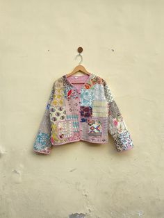 a colorful jacket hanging on a wall