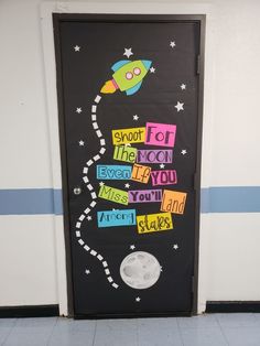 a door decorated with the words shoot for the moon, never forget if you miss you