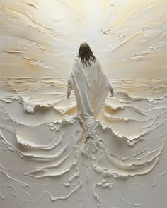 a man standing in front of a white painting